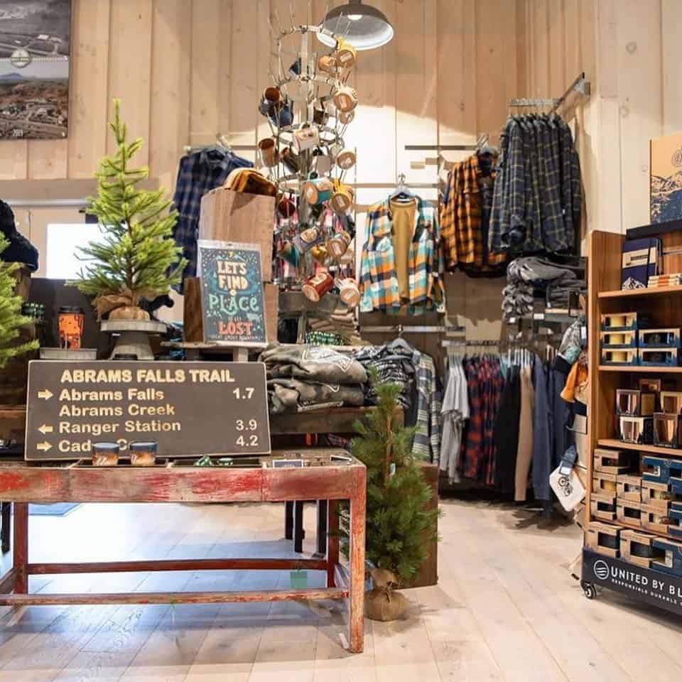 Store display with flannels and abrams falls trail sign