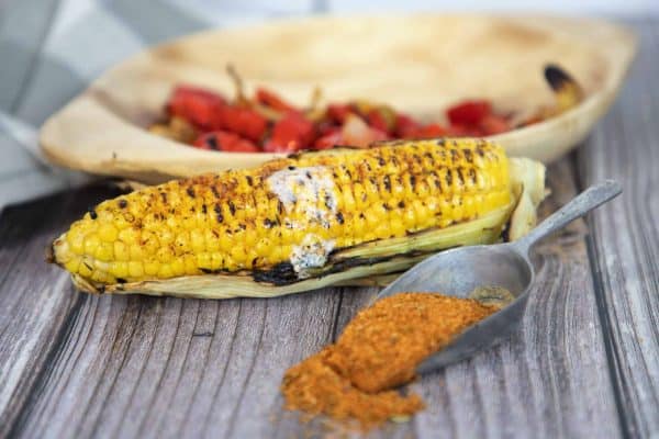 grilled corn with seasoning and butter