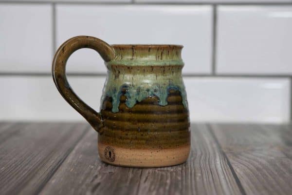 brown and green handmade mug