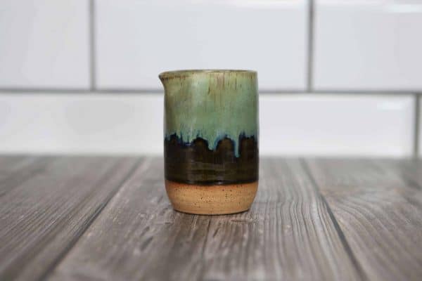 green and brown creamer cup
