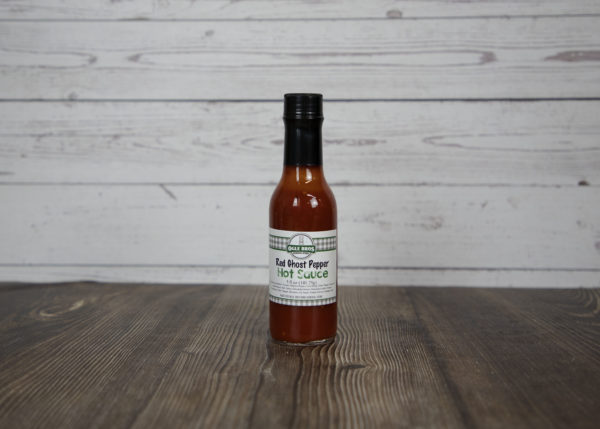 red ghost pepper hot sauce in a glass jar