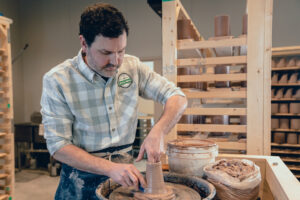 potter making pottery at Ogle Brothers General Store